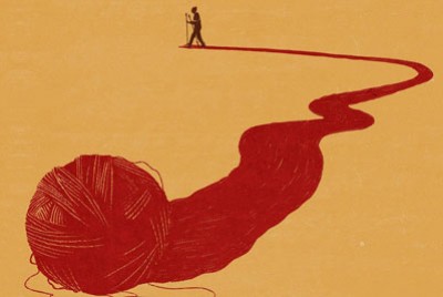 άνδρας που ξετυλίγει ένα κουβάρι και βρίσκεται στο βάθος